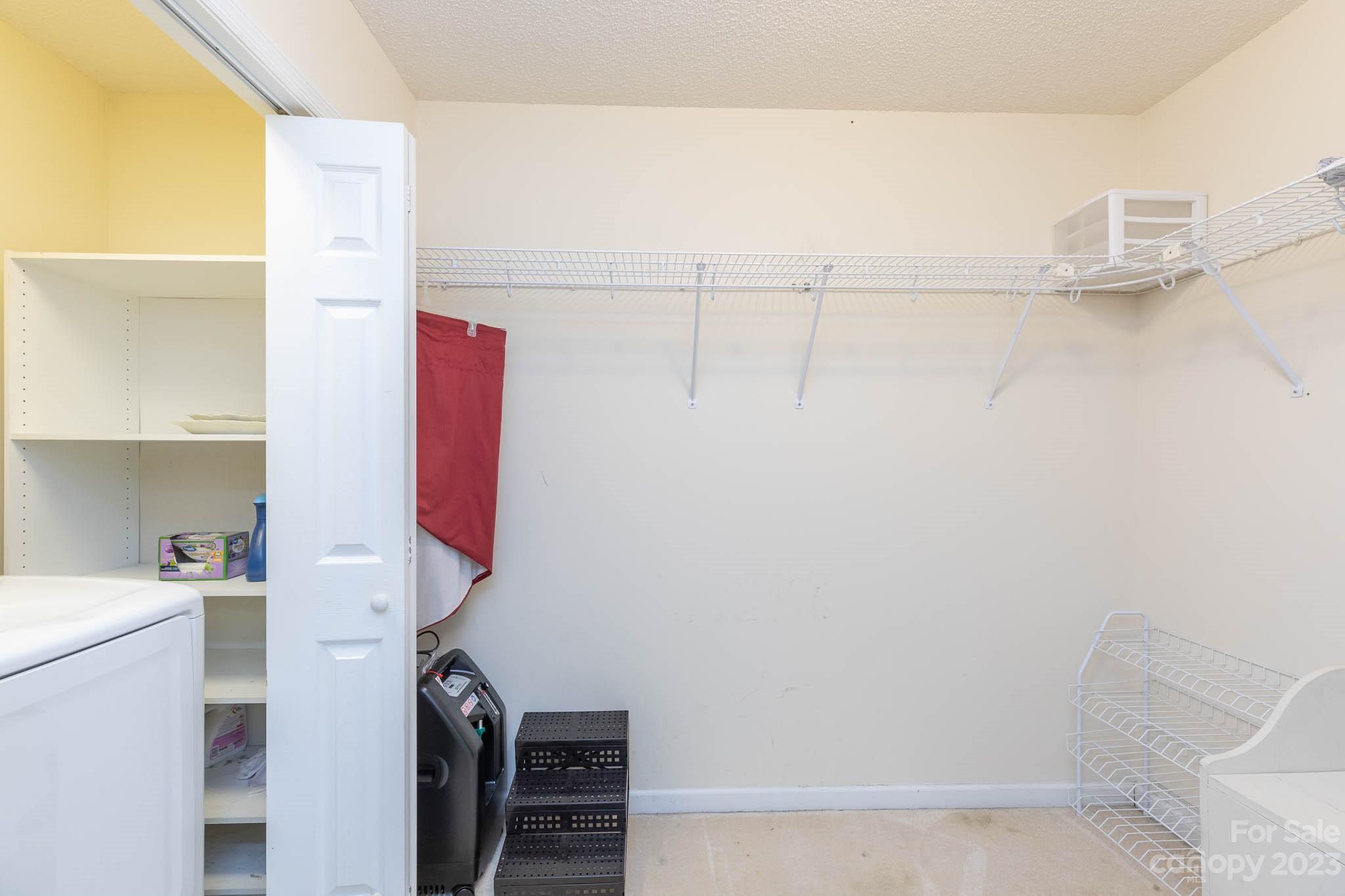 1598 Glenway Road Clover, SC 29710 - Photo 32 of 36 a view of walk in closet with clothes and shoes
