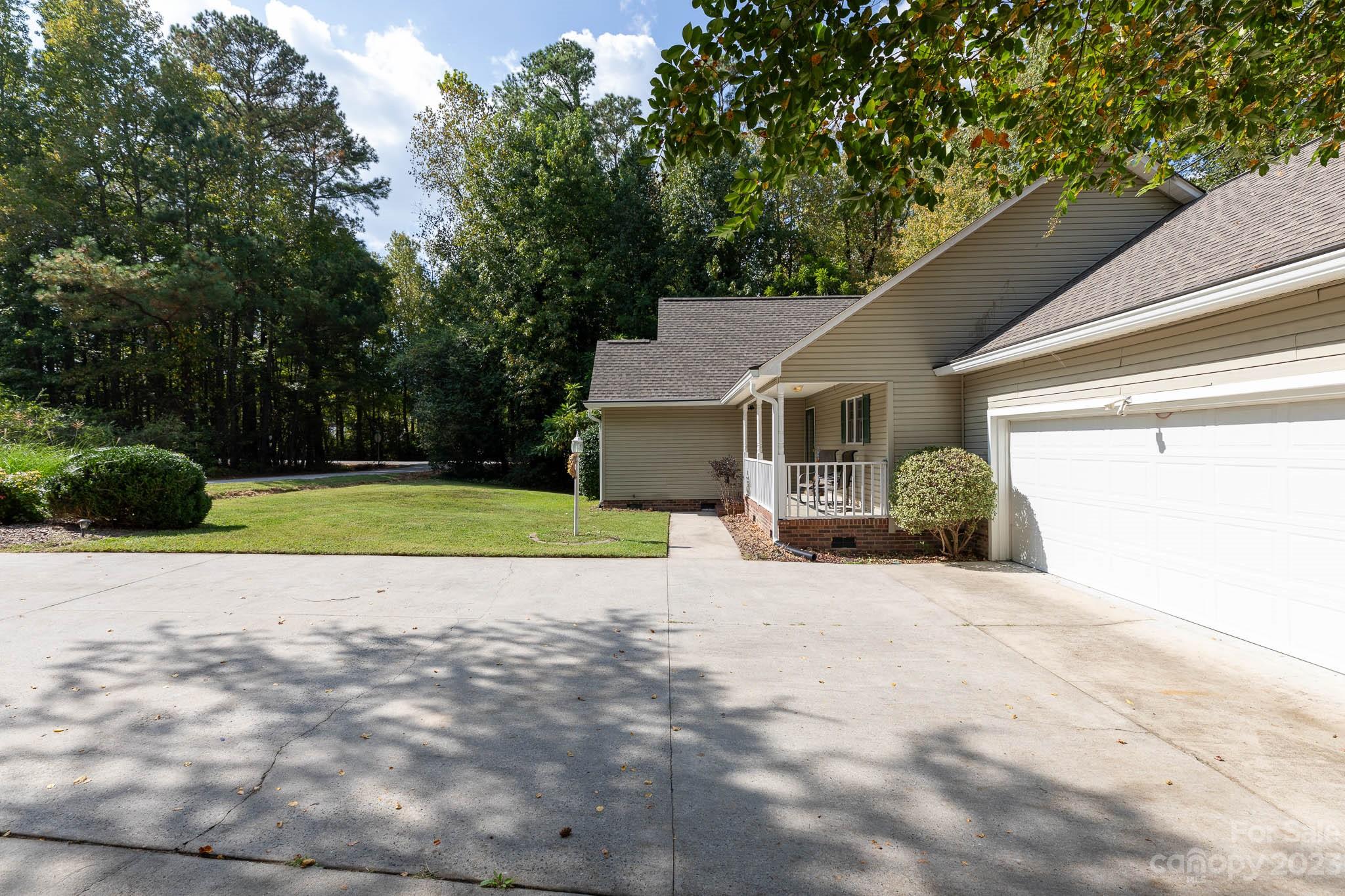 1598 Glenway Road Clover, SC 29710 - Photo 5 of 36 a view of a house with a small yard and a large tree