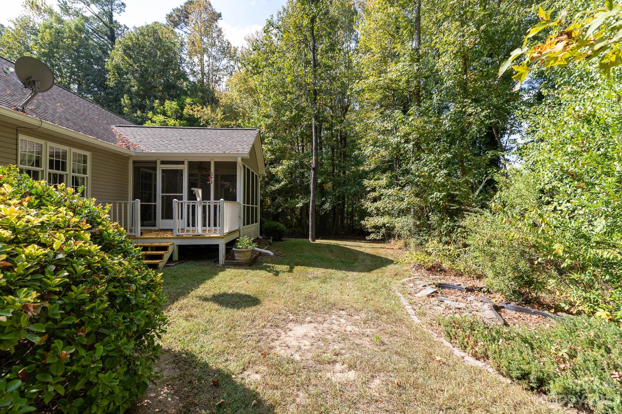 1598 Glenway Road Clover, SC 29710 - Photo 8 of 36 a view of a house with backyard sitting area and garden