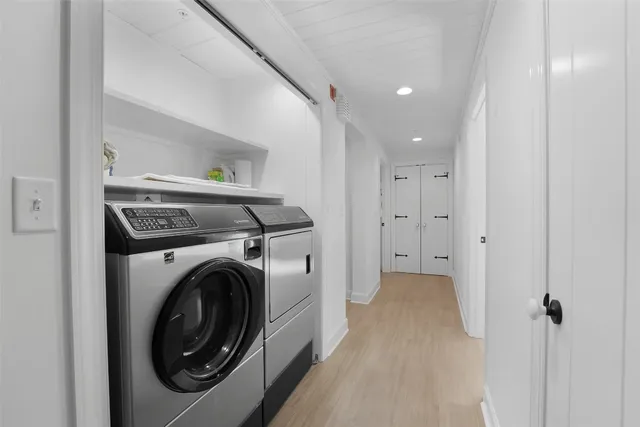 a view of hallway with washer and dryer
