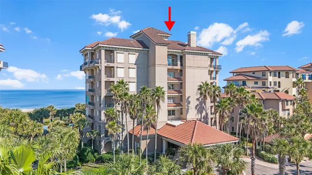 an outdoor space with lounge chairs