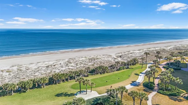 a view of a lake with a house swimming pool and outdoor space