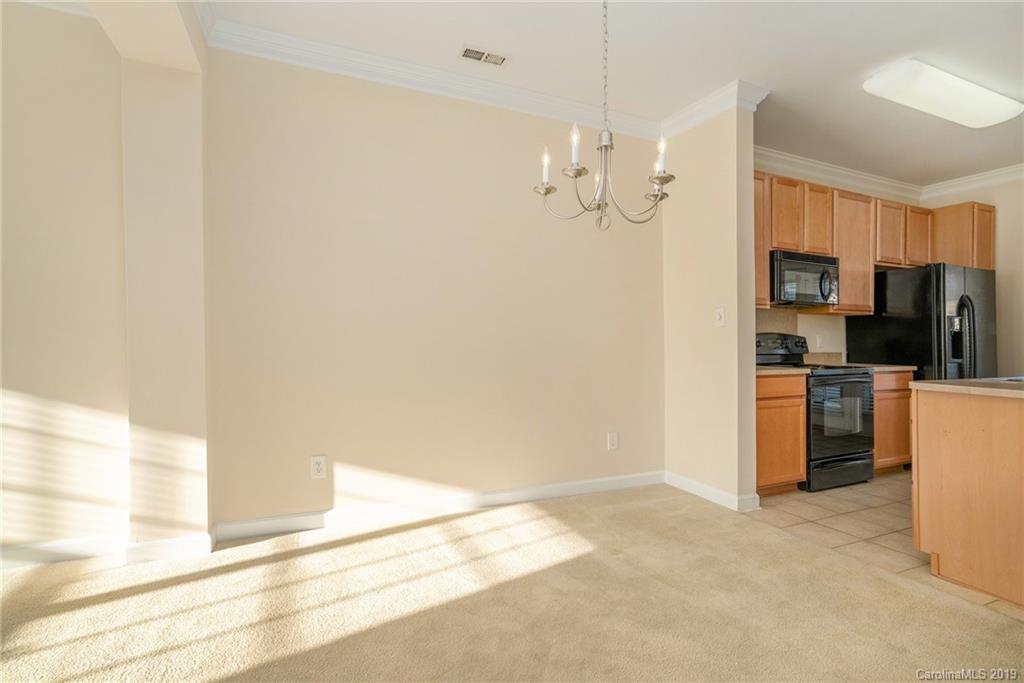 5132 Prosperity Church Road Charlotte, NC 28269 - Photo 11 of 32 a view of a kitchen with a sink and refrigerator