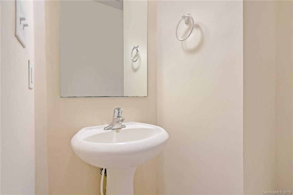 5132 Prosperity Church Road Charlotte, NC 28269 - Photo 17 of 32 a sink with a mirror