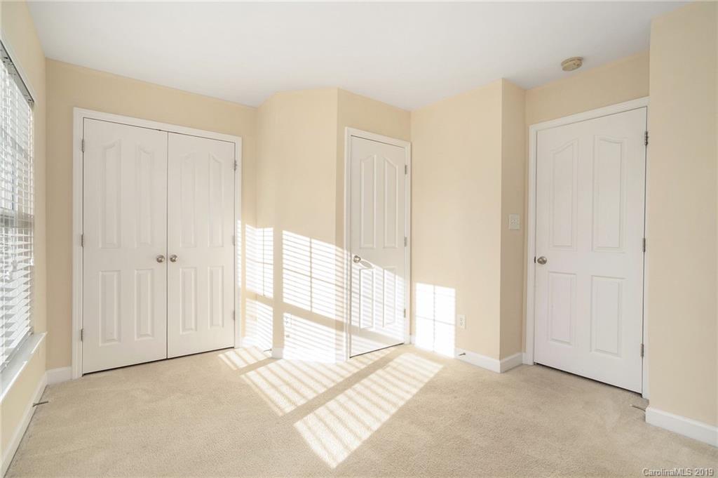 5132 Prosperity Church Road Charlotte, NC 28269 - Photo 18 of 32 a view of an empty room and window