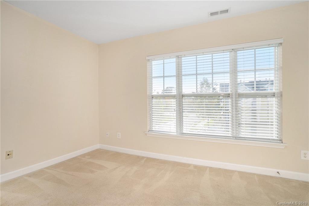 5132 Prosperity Church Road Charlotte, NC 28269 - Photo 20 of 32 an empty room with a window