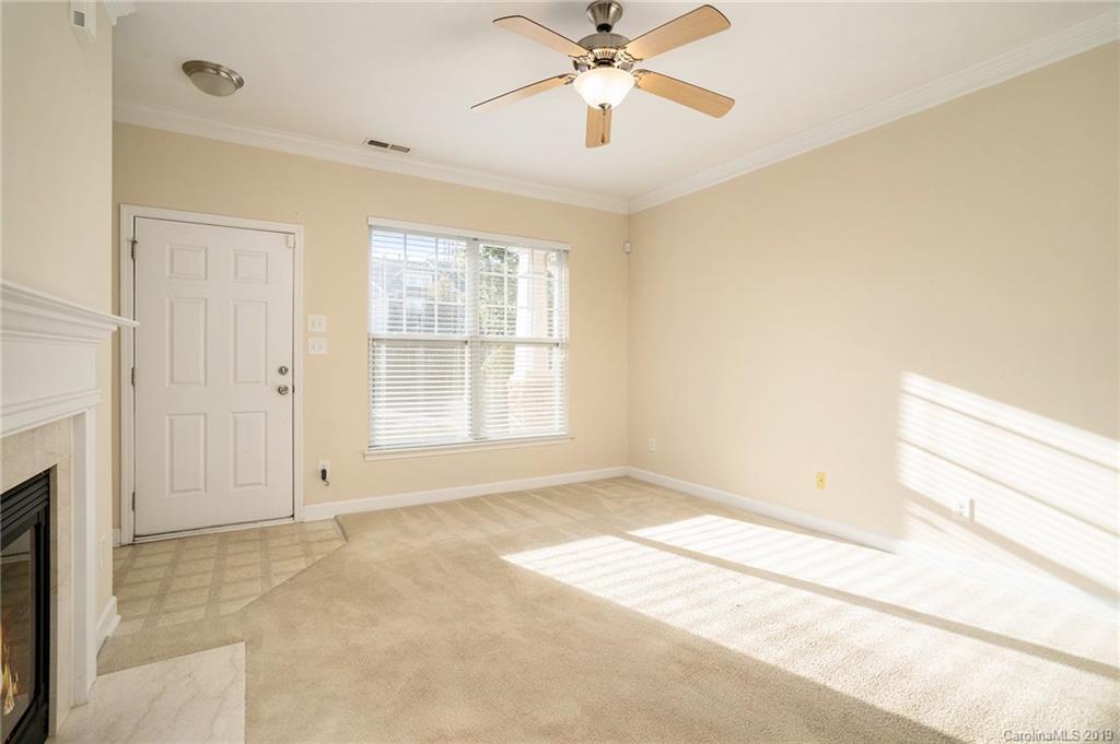5132 Prosperity Church Road Charlotte, NC 28269 - Photo 3 of 32 a view of an empty room with a window