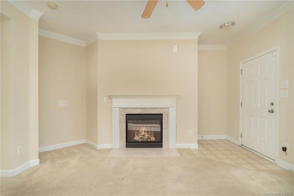 5132 Prosperity Church Road Charlotte, NC 28269 - Photo 5 of 32 a view of an empty room with a fireplace