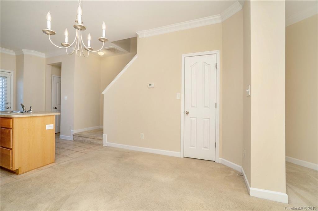5132 Prosperity Church Road Charlotte, NC 28269 - Photo 8 of 32 a view of a kitchen with a sink and cabinet