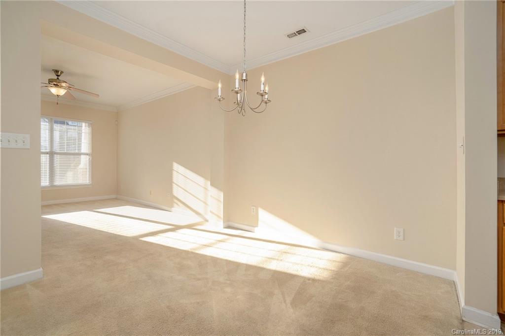 5132 Prosperity Church Road Charlotte, NC 28269 - Photo 9 of 32 a view of an empty room with a window