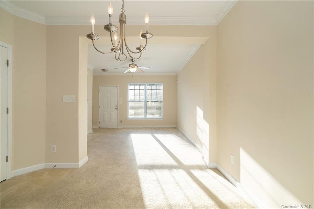 5132 Prosperity Church Road Charlotte, NC 28269 - Photo 10 of 32 a view of an empty room with a window