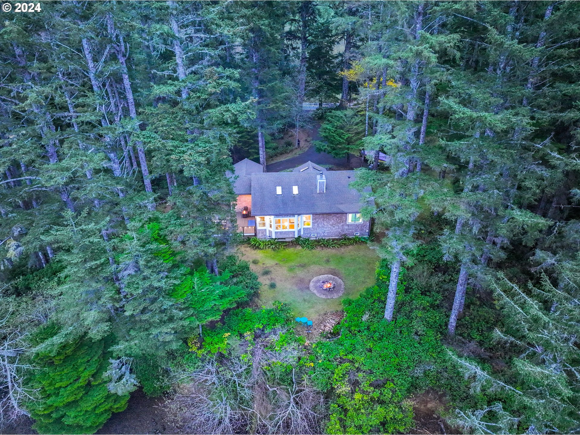 9350 Whiskey Creek Road Tillamook, OR 97141 - Photo 1 of 32 an aerial view of a house with a yard