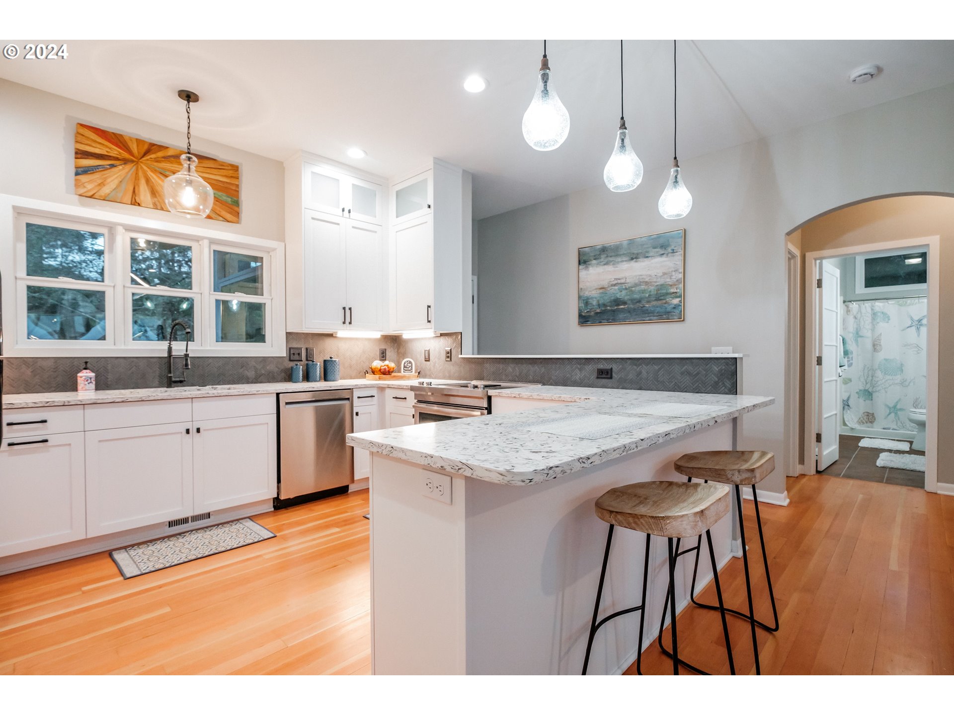 9350 Whiskey Creek Road Tillamook, OR 97141 - Photo 11 of 32 a open kitchen with granite countertop a sink cabinets and wooden floor