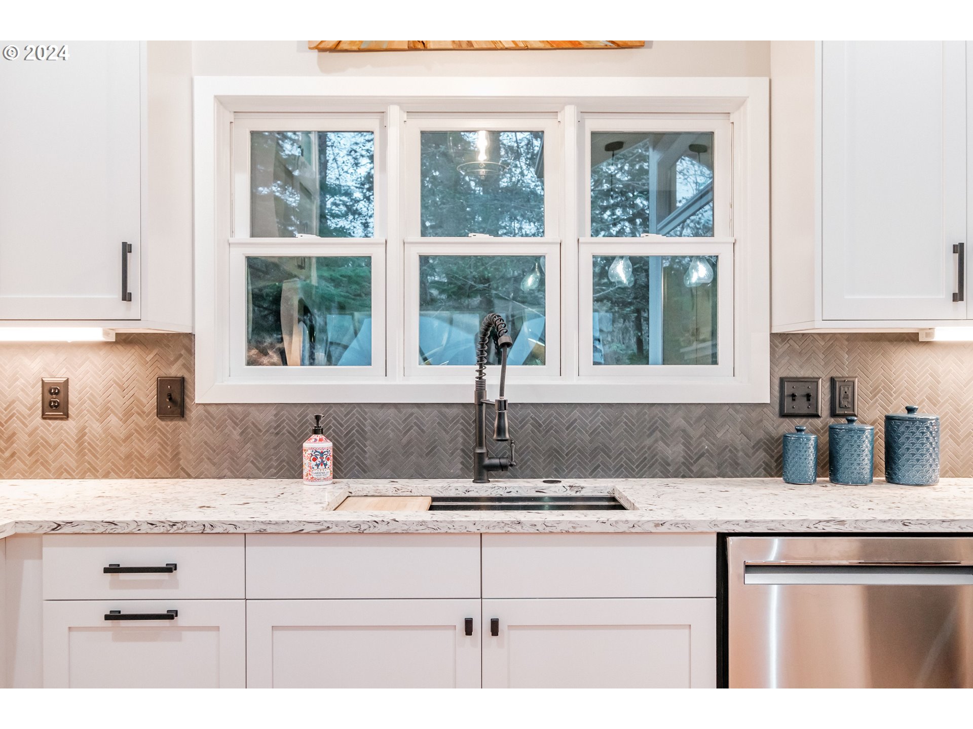 9350 Whiskey Creek Road Tillamook, OR 97141 - Photo 12 of 32 a kitchen with granite countertop a sink and a window