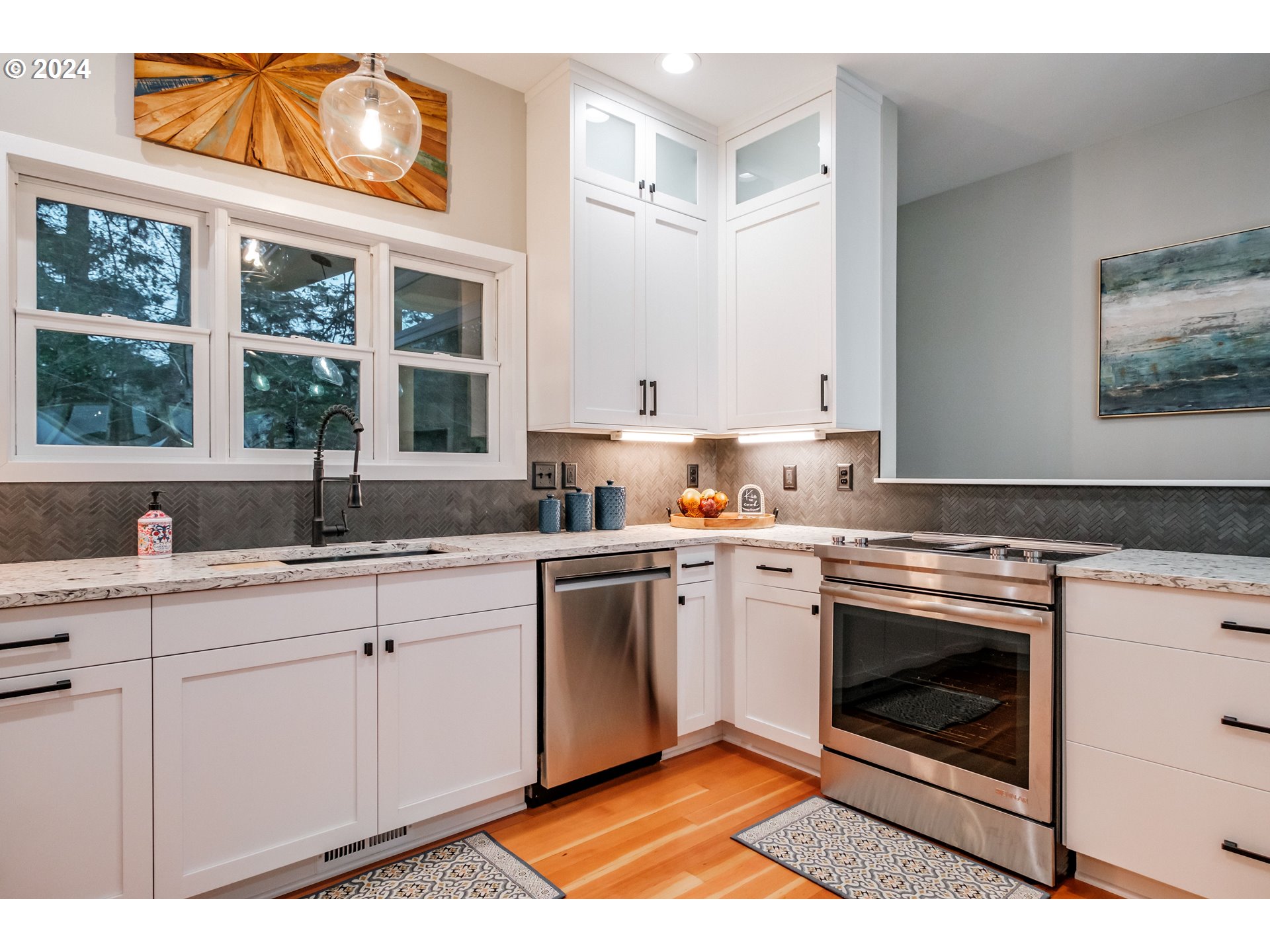9350 Whiskey Creek Road Tillamook, OR 97141 - Photo 13 of 32 a kitchen with stainless steel appliances granite countertop a stove sink and cabinets