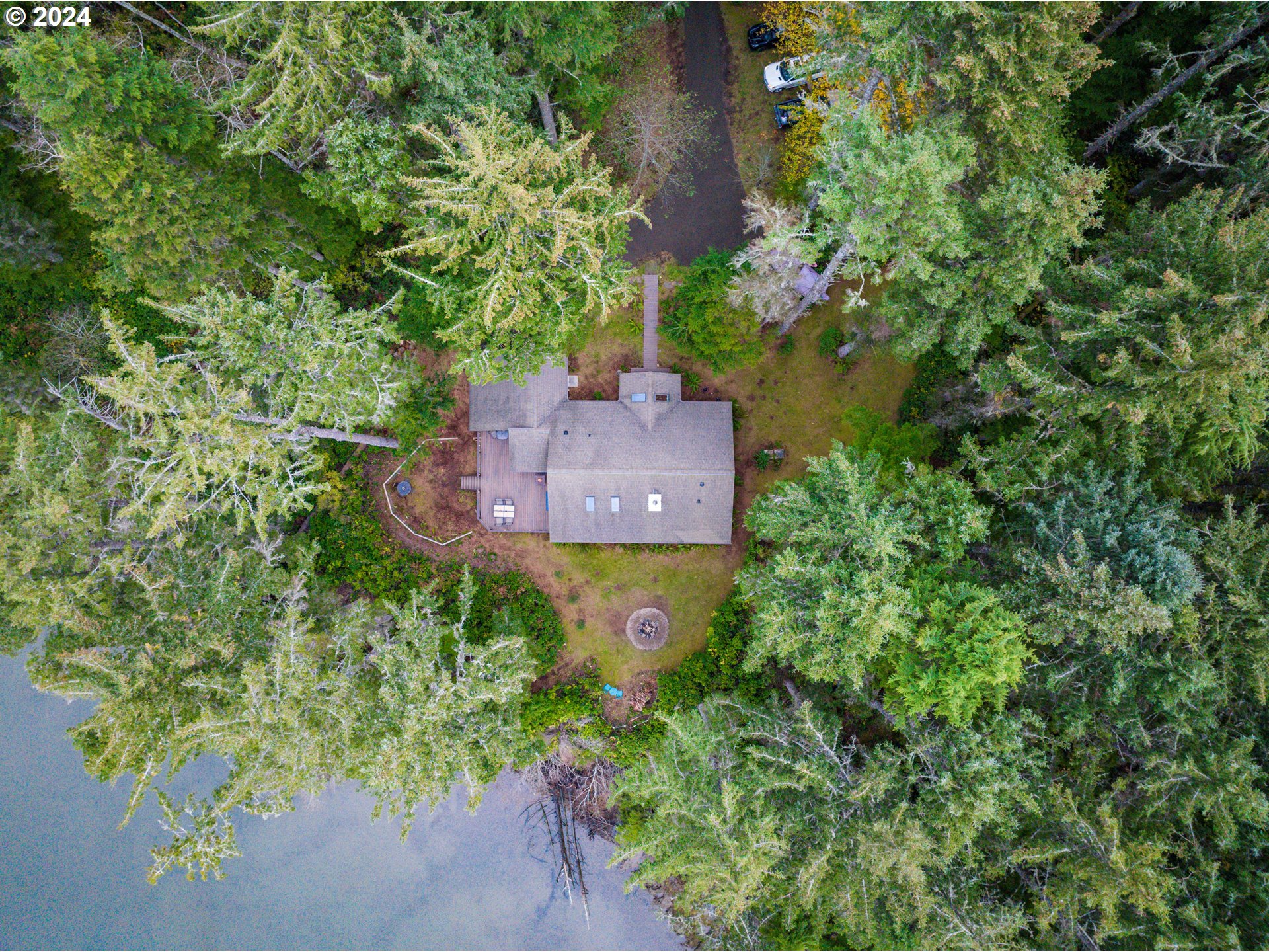 9350 Whiskey Creek Road Tillamook, OR 97141 - Photo 2 of 32 an aerial view of a house with a yard