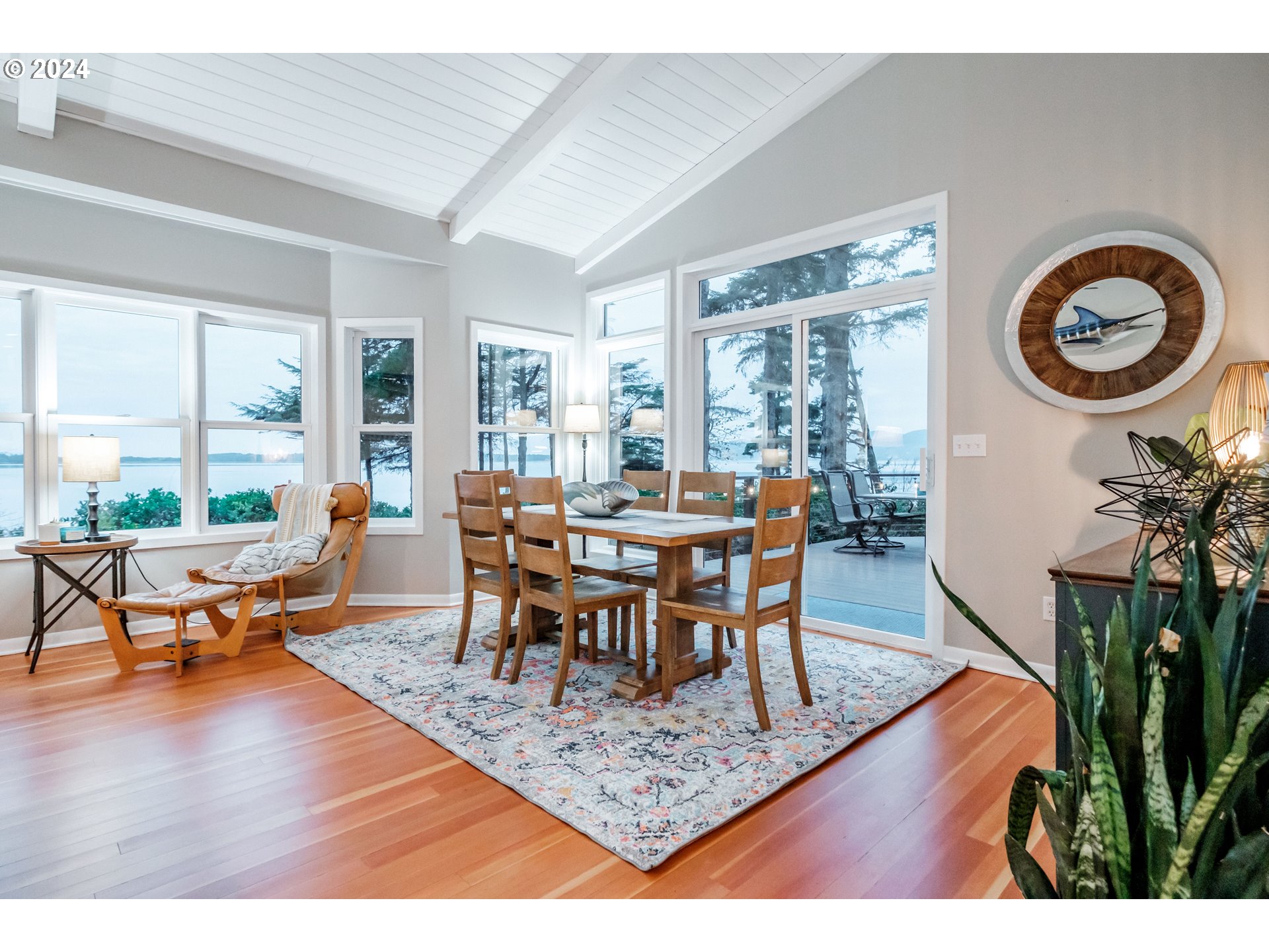 9350 Whiskey Creek Road Tillamook, OR 97141 - Photo 21 of 32 a view of a dining room with furniture window and wooden floor