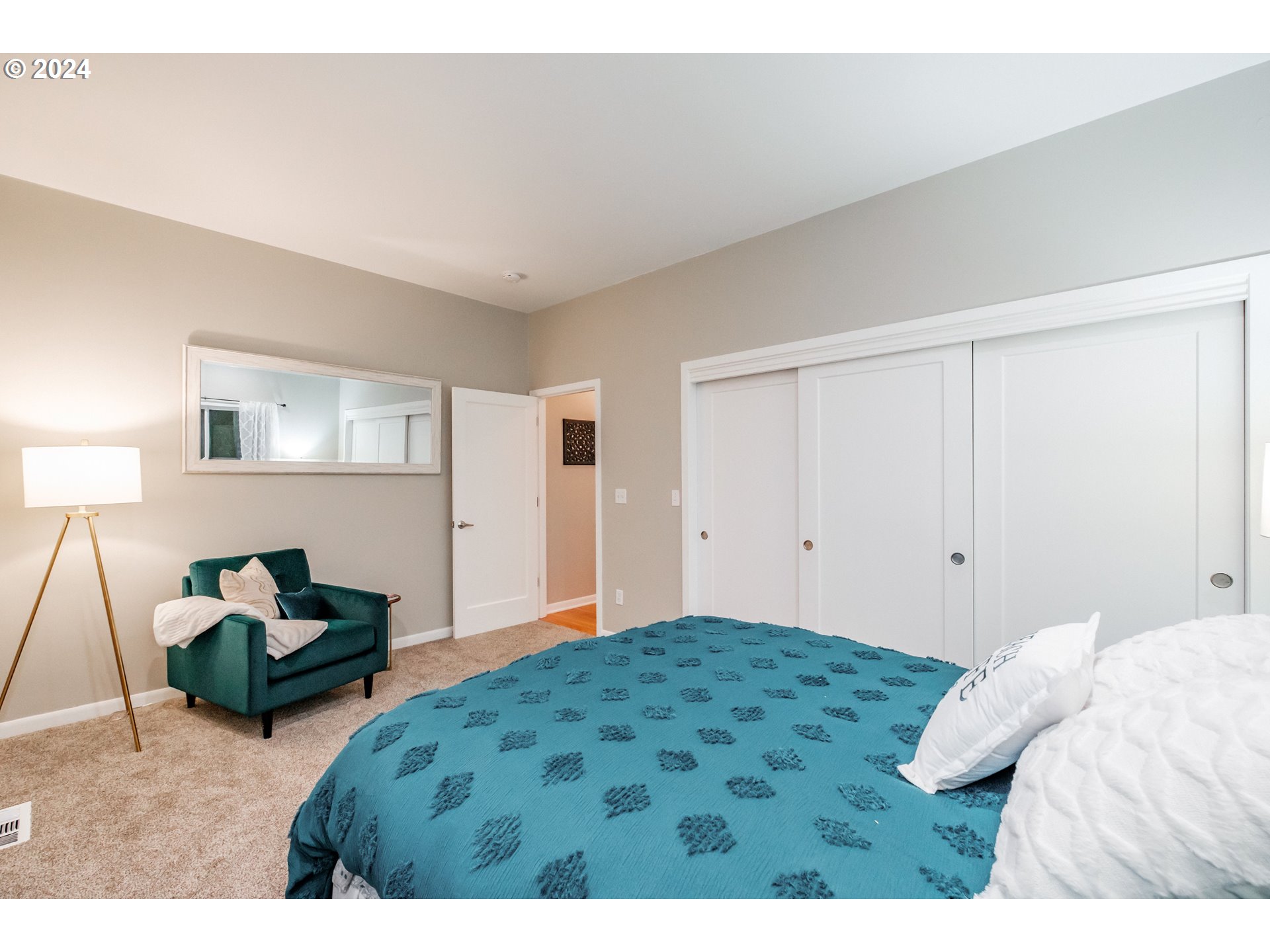 9350 Whiskey Creek Road Tillamook, OR 97141 - Photo 27 of 32 a bedroom with a bed and window