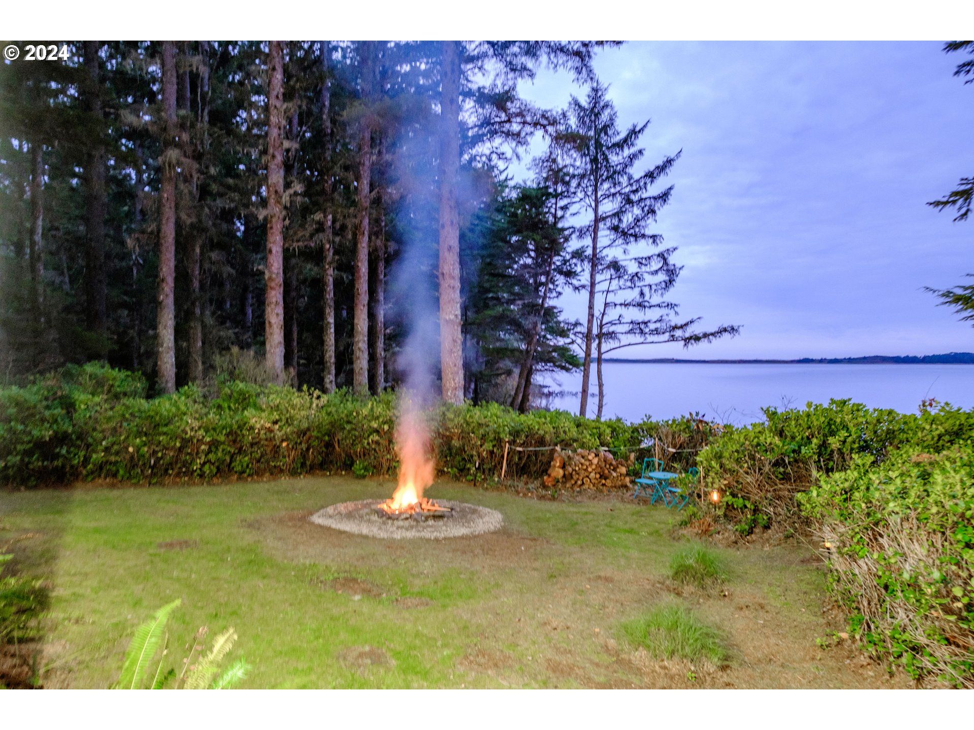 9350 Whiskey Creek Road Tillamook, OR 97141 - Photo 32 of 32 a view of a garden with a fountain