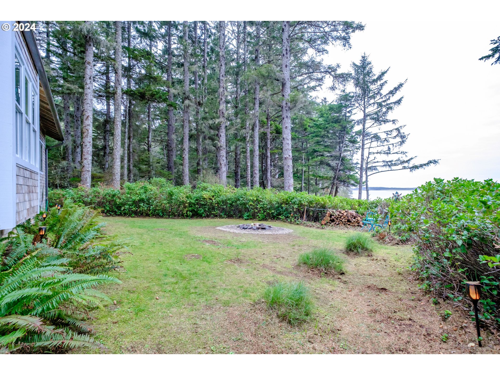 9350 Whiskey Creek Road Tillamook, OR 97141 - Photo 6 of 32 a view of a backyard with garden