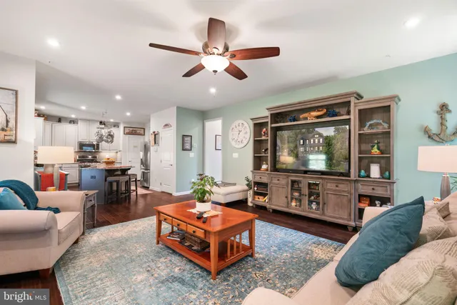 a living room with a couch and a dining table