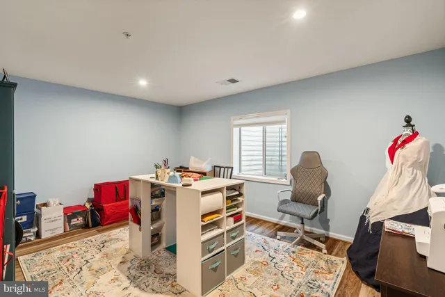 a view of a patio with table and chairs and garden