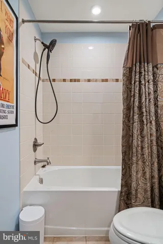 a view of a house with backyard sitting area and garden