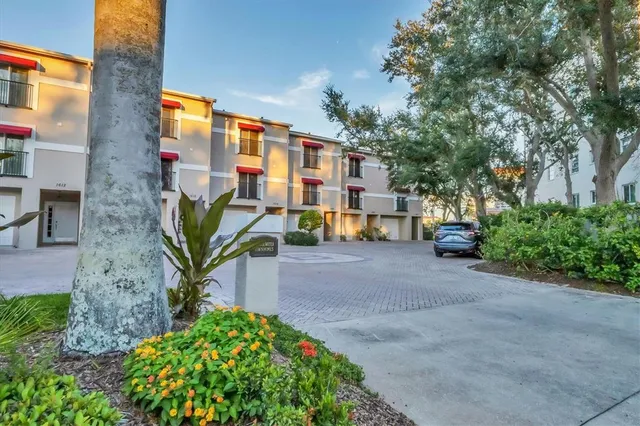 a living room with furniture a flat screen tv and a large window