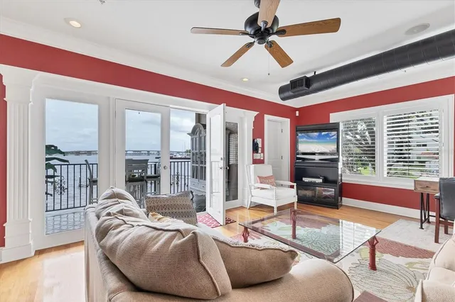 a dining room with furniture and wooden floor