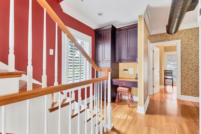 a bedroom with a bed a table and chairs