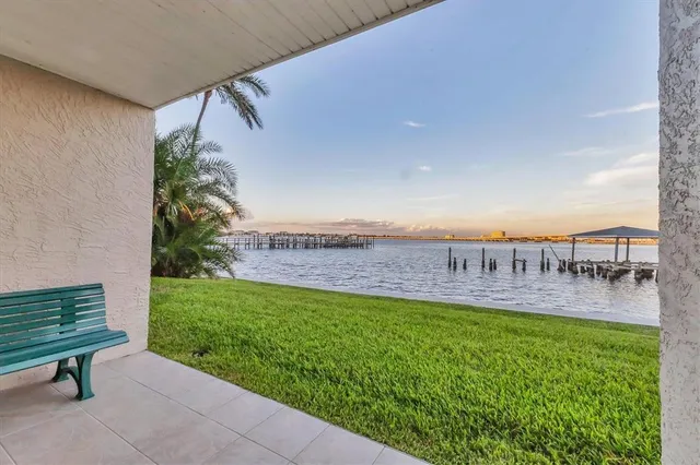 a view of a swimming pool with a lounge chair