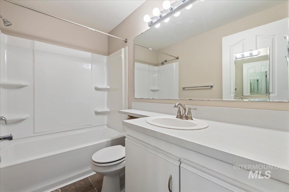 3611 South Gekeler Lane, Unit 124 Boise, ID 83706 - Photo 16 of 27 Bathroom featuring vanity and shower / tub combination
