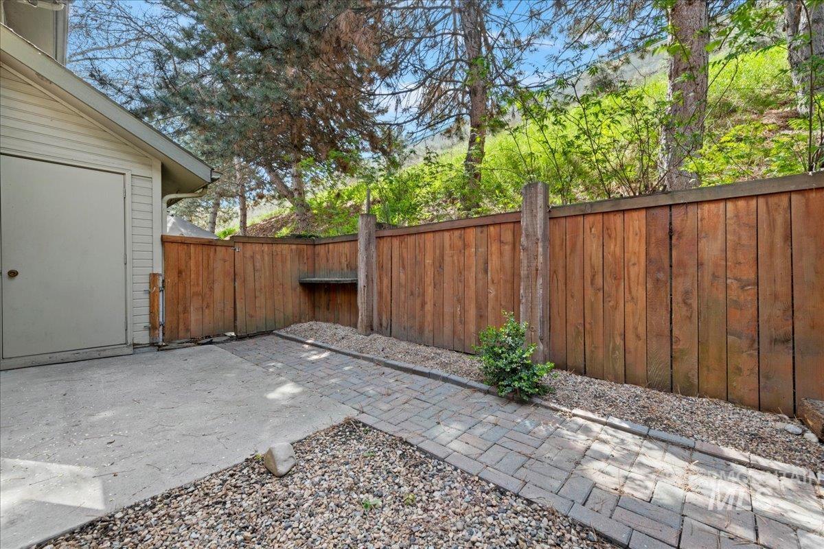 3611 South Gekeler Lane, Unit 124 Boise, ID 83706 - Photo 17 of 27 Fenced backyard featuring a patio