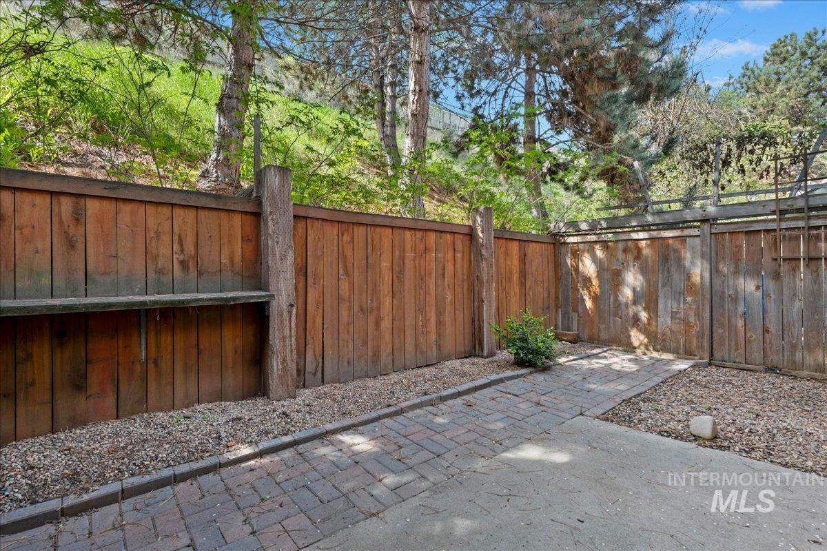 3611 South Gekeler Lane, Unit 124 Boise, ID 83706 - Photo 18 of 27 Gate featuring a fenced backyard and a patio area