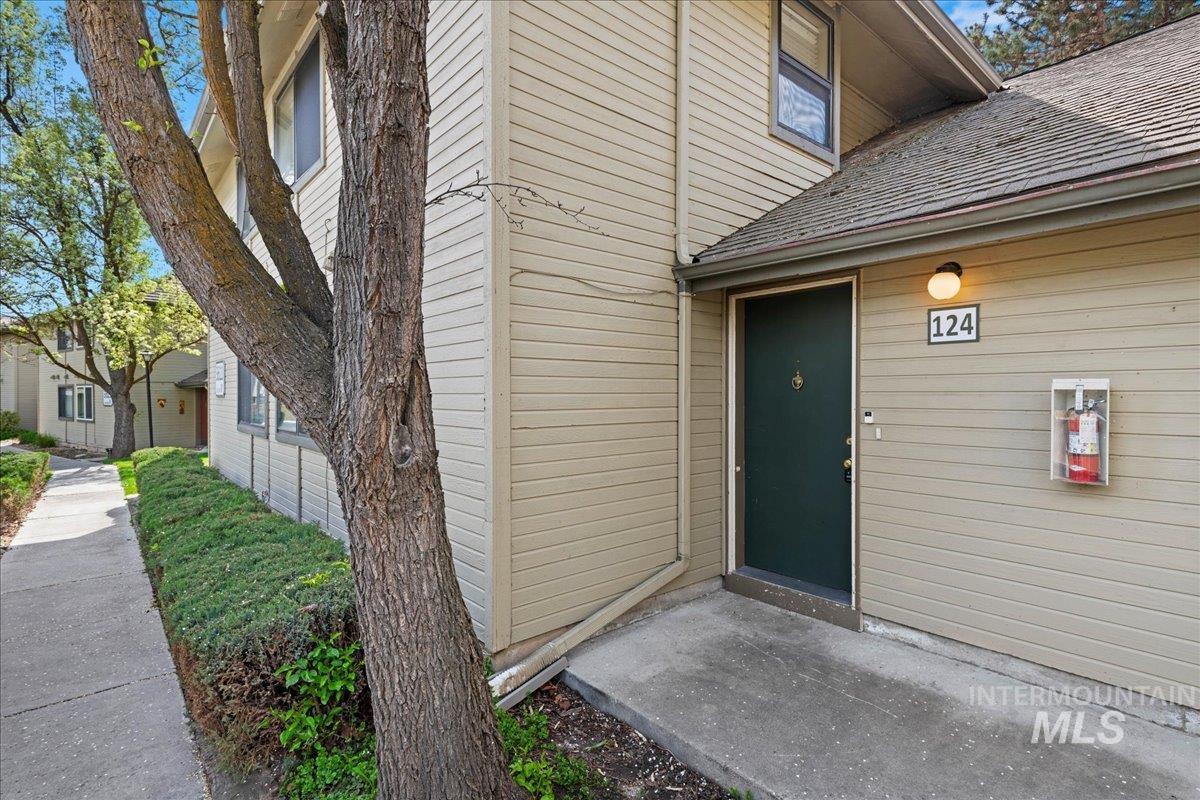 3611 South Gekeler Lane, Unit 124 Boise, ID 83706 - Photo 2 of 27 Entrance to property with a shingled roof