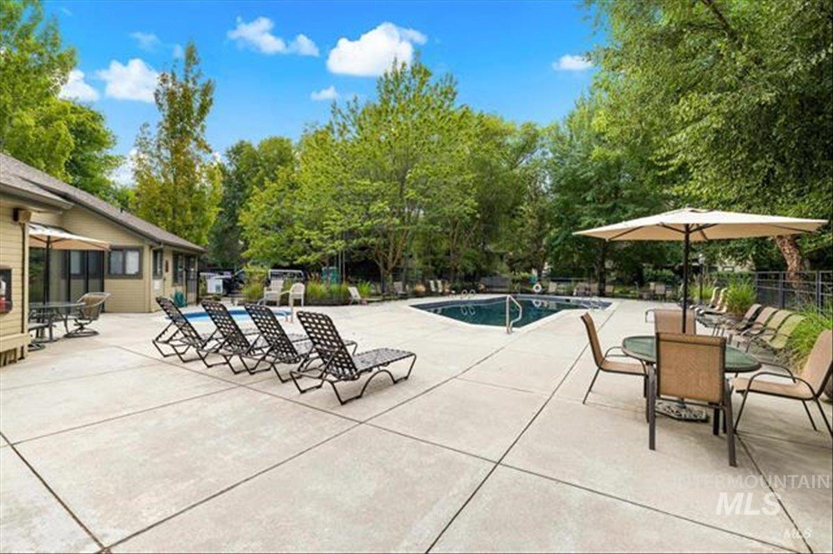 3611 South Gekeler Lane, Unit 124 Boise, ID 83706 - Photo 21 of 27 Community pool featuring a patio area