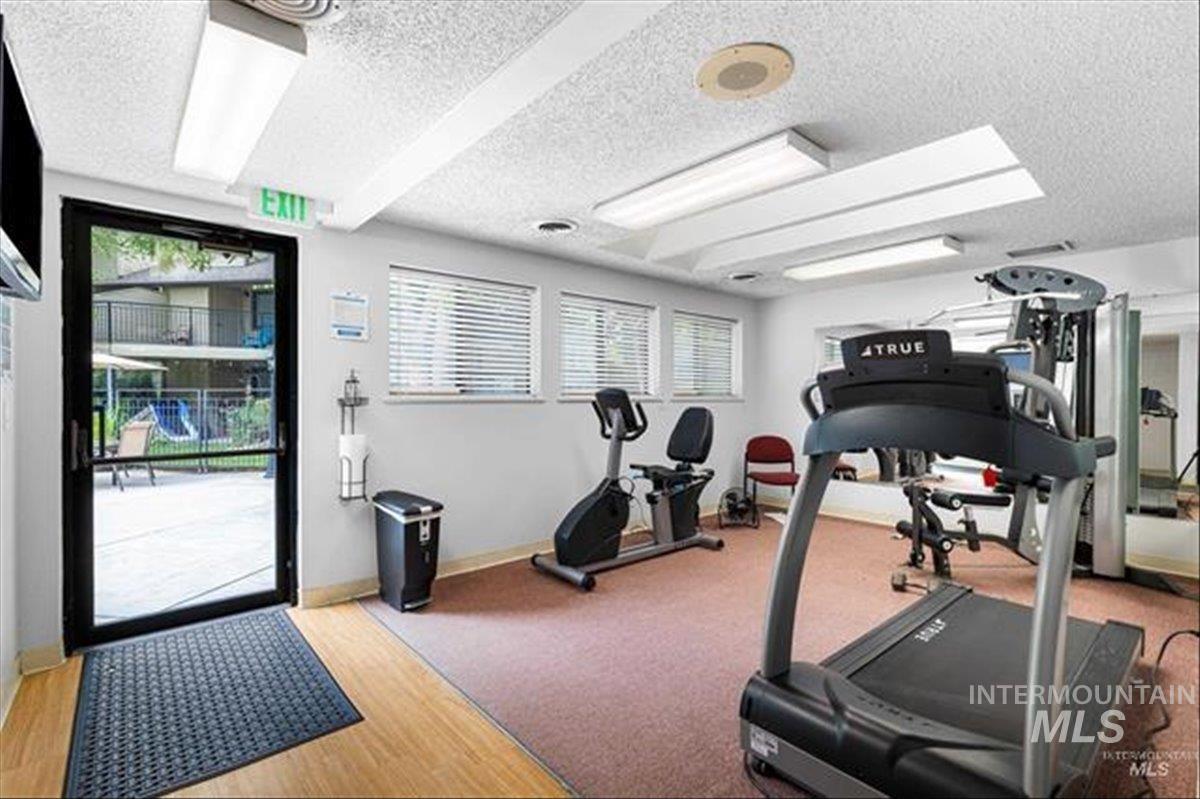3611 South Gekeler Lane, Unit 124 Boise, ID 83706 - Photo 23 of 27 Exercise room with a textured ceiling