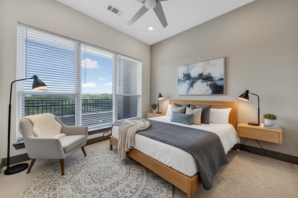 2700 Old Denton Road, Unit 2236 Carrollton, TX 75007 - Photo 14 of 23 a spacious bedroom with a bed and a couch