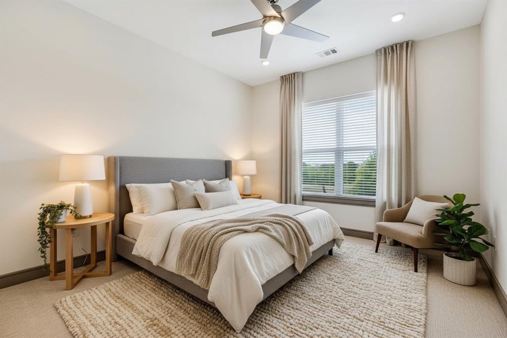 2700 Old Denton Road, Unit 2236 Carrollton, TX 75007 - Photo 6 of 23 a bedroom with a bed and a potted plant