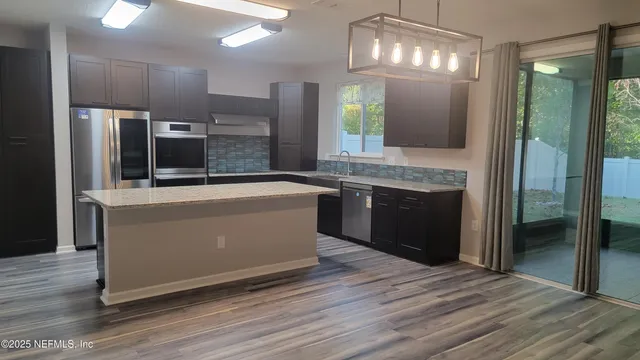 a bathroom with a bathtub and a sink