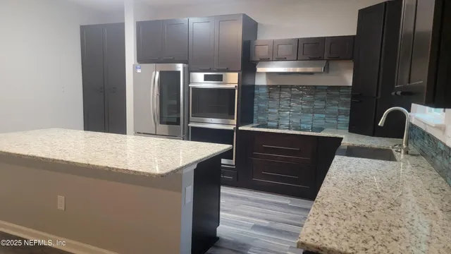 a view of a room with staircase and white door
