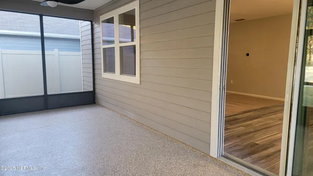 a room with a window and a ceiling fan