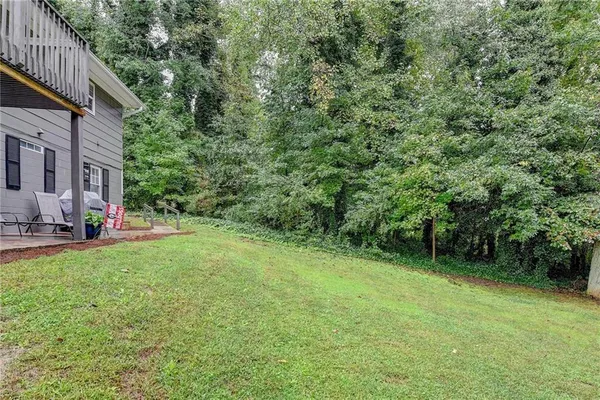 a view of backyard with green space