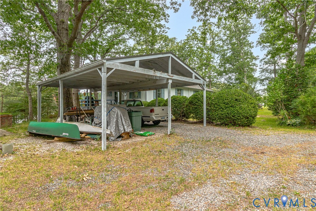 142 Bridge Lane Reedville, VA 22539 - Photo 35 of 56 a view of a chair and table in backyard of the house