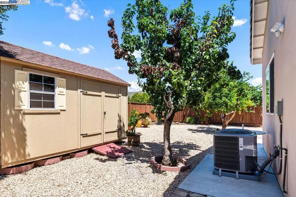 a view of a backyard with sitting area