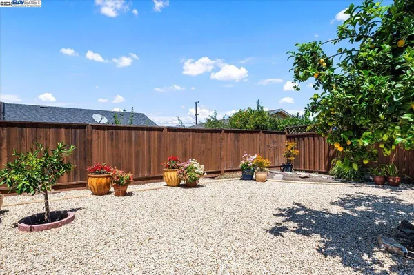 a view of a backyard with sitting area