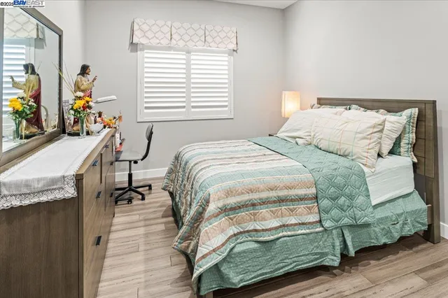 a bedroom with a bed and a table