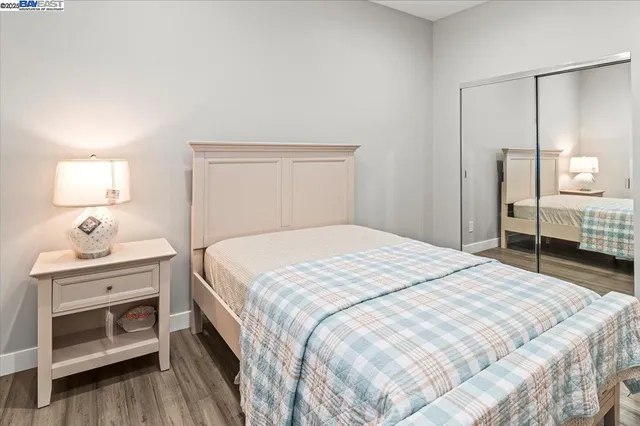 a bedroom with a bed and a dresser