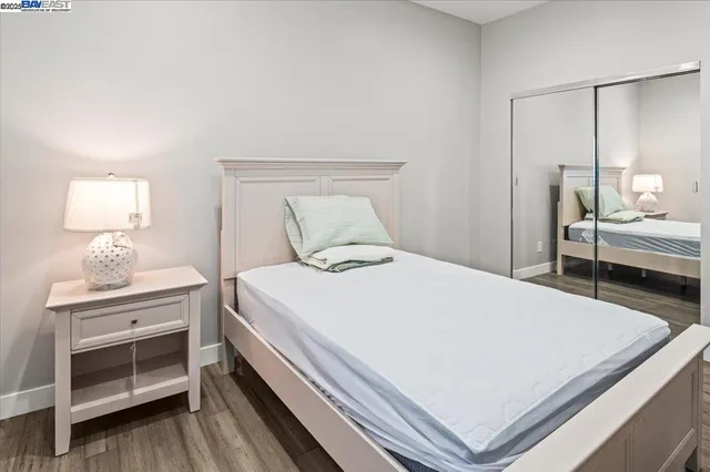 a bedroom with a bed and a desk