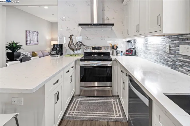 a kitchen with a sink stove and cabinets